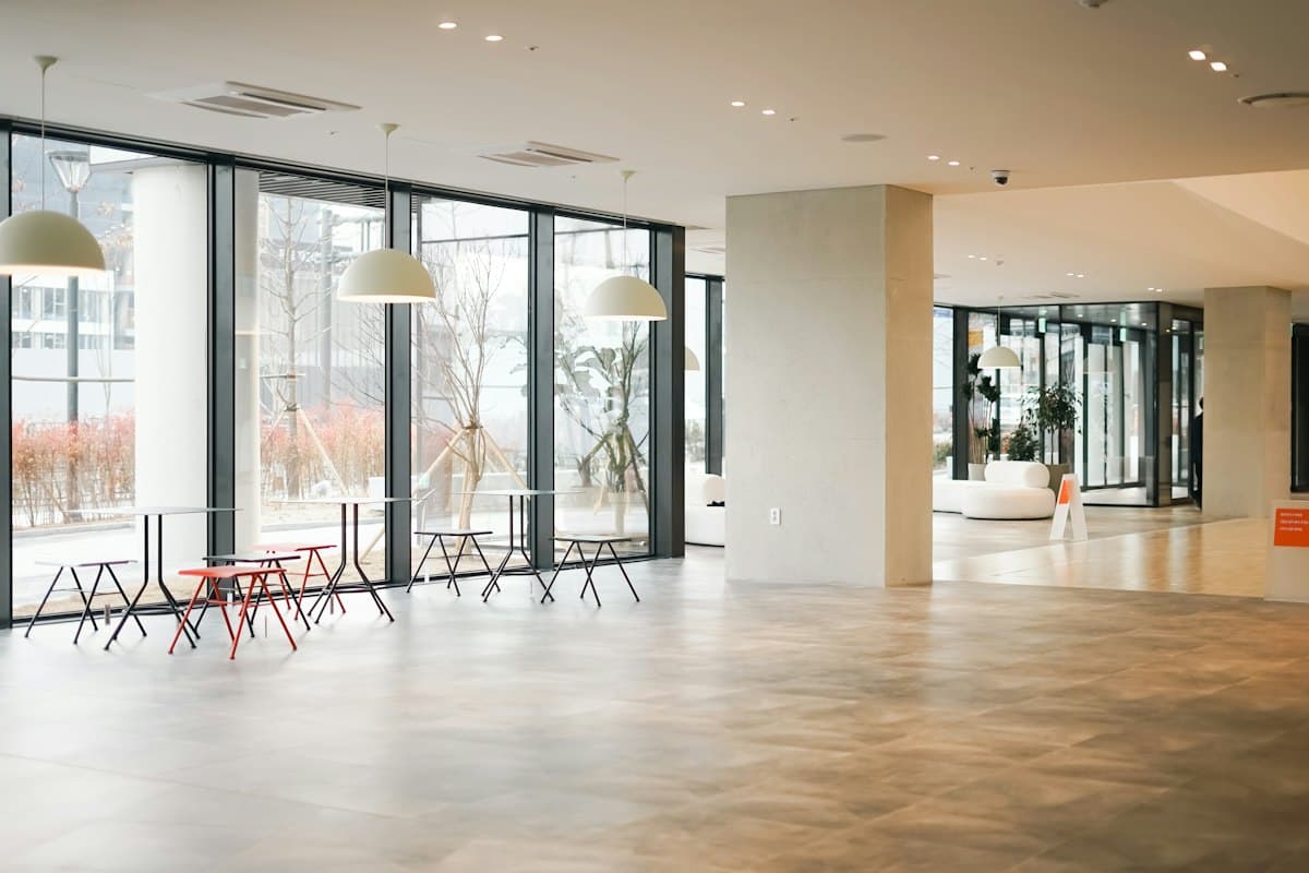 A large open study space with tall windows and rows of chairs