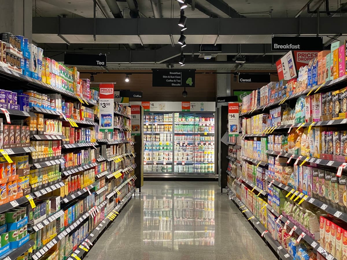 A grocery store aisle with fully stocked shelves